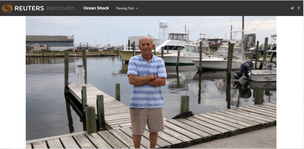 A man standing on a dock in a photo.